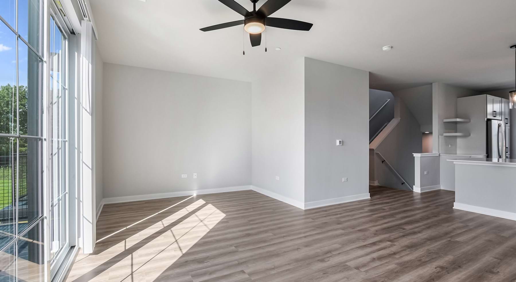 large picture windows in bright living room