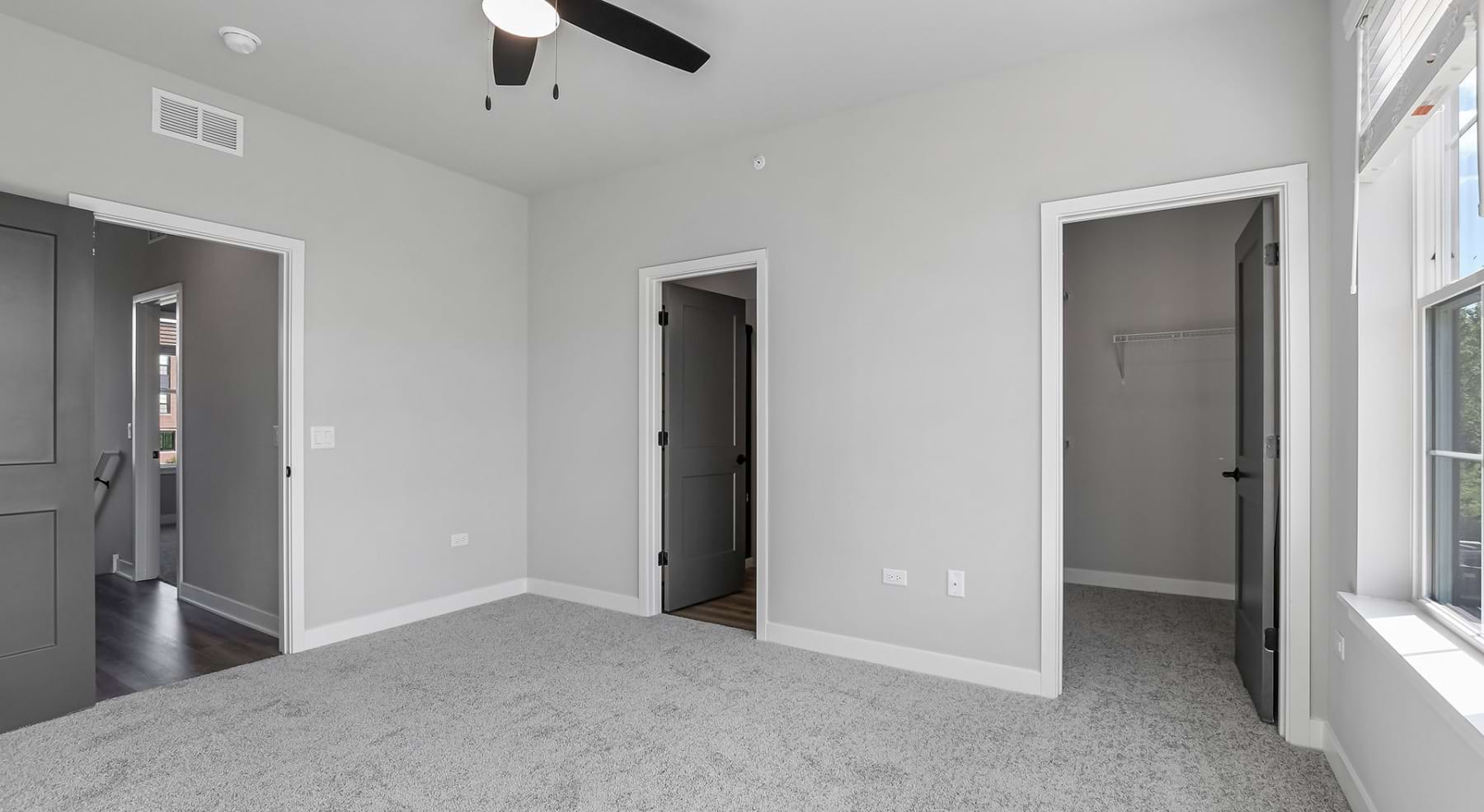 bedroom with walk-in closet and private bathroom