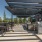 BBQ Area with Stainless Steel Grills, Patio Chairs and Tables, and Umbrellas